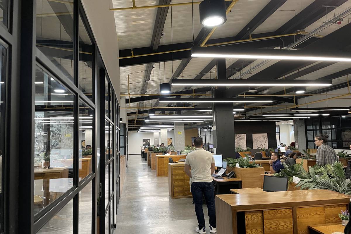The main aisle of the Medellín floor, sales and purchasing desks on either side.